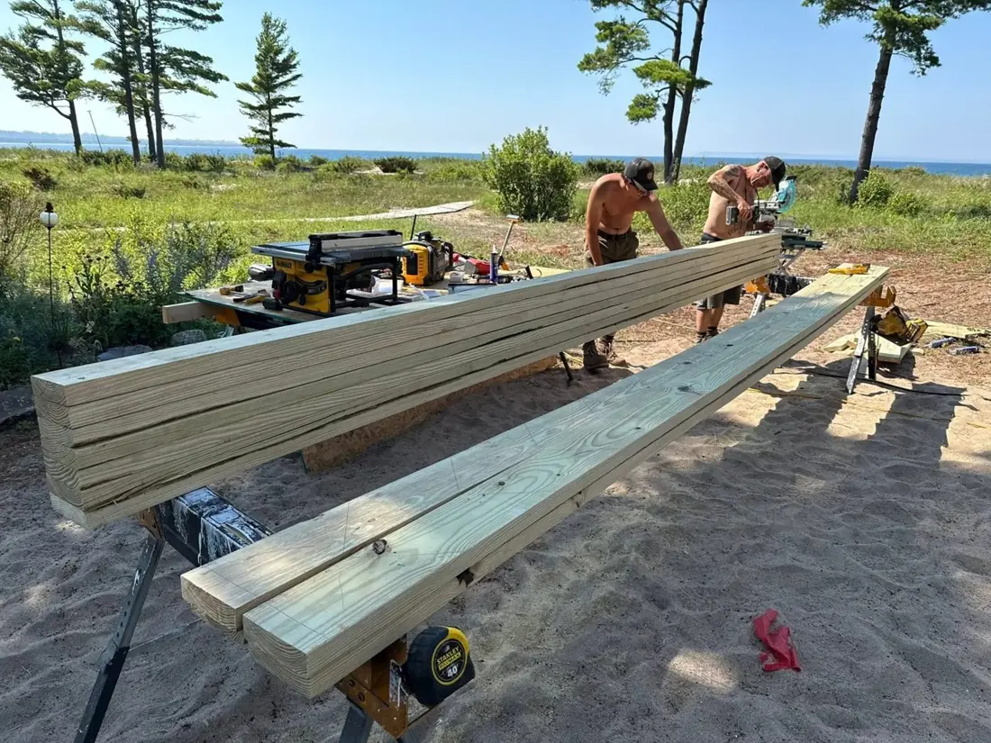 Lumber beams being cut on a worksite